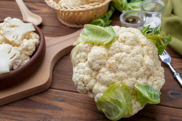 Organic cauliflower on wooden background