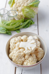 Organic cauliflower on wooden background