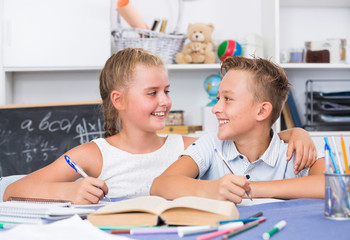 Fototapeta premium Brother with sister are doing homework