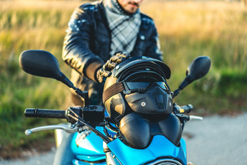 Man on sport motorcycle outdoor on the road