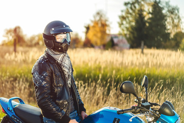 Man on sport motorcycle outdoor on the road
