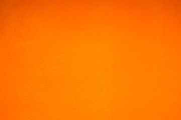 Grunge orange plaster wall with smears