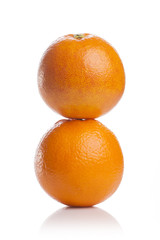 two fresh oranges close up isolated white.