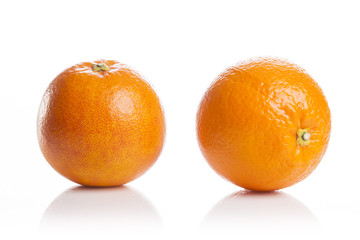 two fresh oranges close up isolated white.