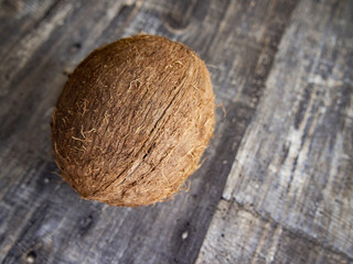 large coconut on a wooden table
