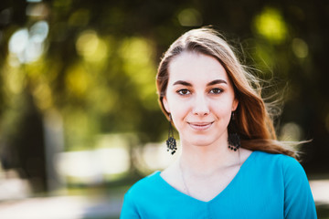 Portrait of a young woman on a blurred background