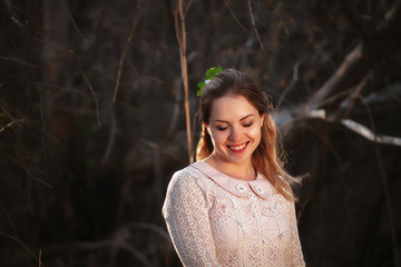 portrait of a girl in a field on a sunset background