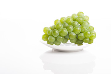 green grapes on the white background.