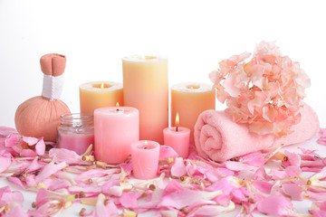 Obraz na płótnie Canvas Many pink tropical petals and candle ,soap ,herbal ball,towel ,candle, salt in bowl 
