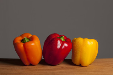 pigment fresh fruits on the wood table, grey background.