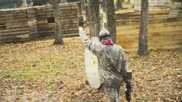 playing paintball in the Woods