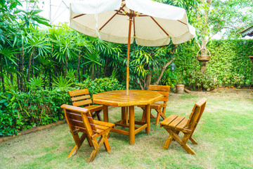 empty wood outdoor patio table and chair in home garden