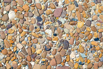 fragment of surface with decorative filling with sea pebbles
