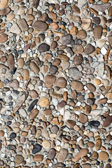 fragment of surface with decorative filling with sea pebbles