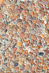 fragment of surface with decorative filling with sea pebbles