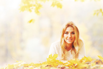 Woman laying in autumn park