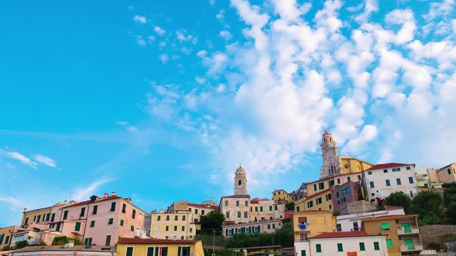 The historical town of Cervo, Liguria, Italy, perched on the hills in front of the Ligurian Sea. Scenic motion clouds time lapse