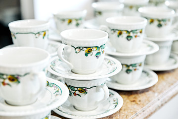 cups and saucers in a number