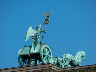 The Quadriga of Brandenburg Gate Against A Blue Sky In Berlin, Germany © cbies