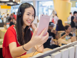 Young woman using a smartphone indoor.