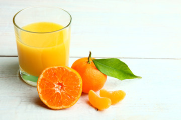 tangerines and glass of juice