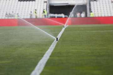 watering the football field