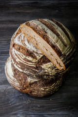 two big handmade round black pieces of bread