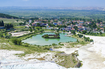 lake in Pamukkale with a view of the city on a sunny day