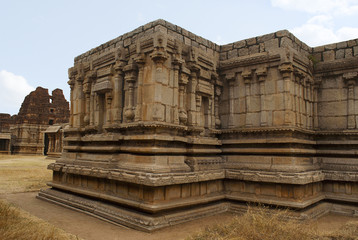 Fototapeta premium Twin chambered shrine of goddess, west side view, Achyuta Raya temple, Hampi, Karnataka. Sacred Center. The north gopura is ssen in the distance on the left.