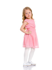 A cheerful little girl is dancing.