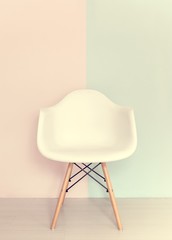 White chair on pastel background