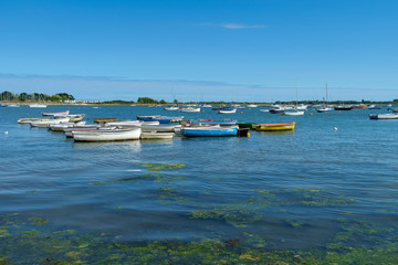 Naklejka premium Small boats at high tide, Emsworth, Hampshire, UK.