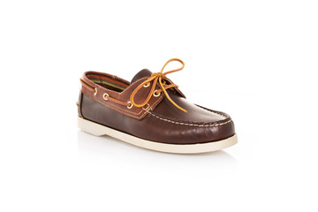 Close up of a brown mens top-sider boat shoes with white sole on white background with reflection. Fashion advertising shoes photos.