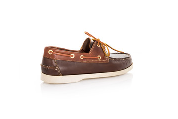 Close up of a brown mens top-sider boat shoes with white sole on white background with reflection. Fashion advertising shoes photos.