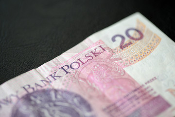 Twenty Polish zlotys on a dark background close up