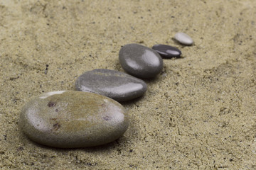Fototapeta na wymiar stone row on a sand