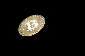 Golden Bitcoin on black background.Virtual money.