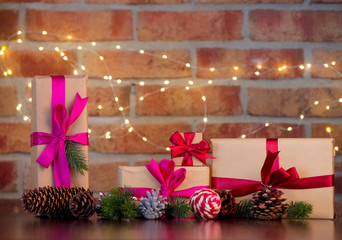 gift boxes on background with fairy lights in bokeh. Christmas Holiday season