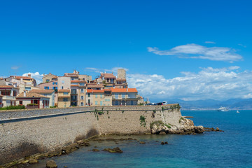 Naklejka na ściany i meble The old town of Antibes and defensive stone walls occupying a prominant position on the Mediterranean, French Riviera.