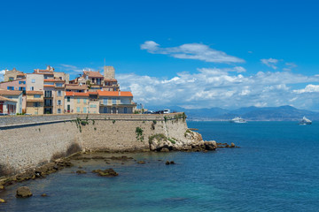 Obraz na płótnie Canvas The old town of Antibes and defensive stone walls occupying a prominant position on the Mediterranean, French Riviera.
