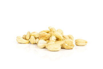 Lot of whole raw cashew nut pile isolated on white background