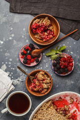 Breakfast with coffee and crumble pie, dark background, healthy vegan breakfast concept.