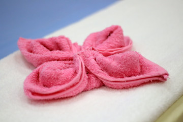Towels craft flowers Thai traditional style decoration in massage spa.