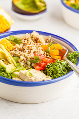 Vegan healthy rainbow salad, buddha bowl with quinoa, tofu, avocado and kale.