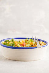 Vegan healthy rainbow salad with quinoa, tofu, avocado and kale.