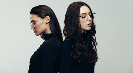 Female models in black outfit and glasses