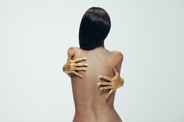 Sensual woman hugging herself