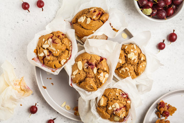 Berry oatmeal muffins on a white background, top view. Healthy vegan dessert.