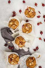 Berry oatmeal muffins on a white background, top view. Healthy vegan dessert.