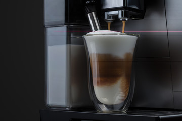 Coffe glass full of coffee in coffemachine 